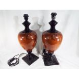 Two matched pair of good quality ceramic table lamps,