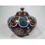 Cloisonne - A good quality Cloisonne lidded pot with a floral decoration 10cm (h)