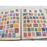 An album containing a good collection of mounted early 20th century and later world stamps