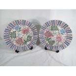 A matched pair of Chinese chargers decorated in a floral design 32cm (dia) (2)