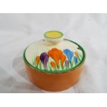 Clarice Cliff - a lidded pot hand-painted in the crocus pattern, 7.2 cm (h) x 10.