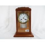 A glass and wood cased mantel clock,