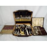 A collection of boxed flatware to include a part canteen of cutlery marked Zippakut,