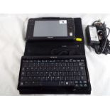 A Samsung Q1 Ultra Notepad with keyboard,