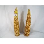 A pair of highly detailed decorative faux tusks 40cm (h)