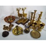 A good collection of period ornamental brassware to include candlesticks,