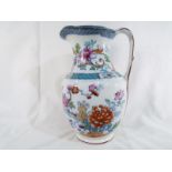 A water jug hand painted in a floral design c.