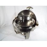 Catering equipment - a stainless steel Deluxe Round Roll Top Chafing Dish on supports with Lumea