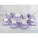 Shelley - a tea set by Shelley comprising 6 cups, 6 saucers, 7 plates, milk jug and bowl,