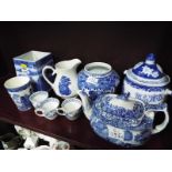 A collection of blue and white ceramics to include Ringtons Ltd tea merchandise,