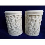 A pair of 19th century highly carved ivory Japanese brush pots with finely carved design work