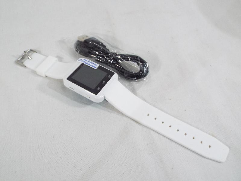 Unused surplus retail stock (not returns) - an android Smart watch with charger cable, white,