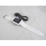 Unused surplus retail stock (not returns) - an android Smart watch with charger cable, white,