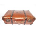 A vintage leather and wood suitcase