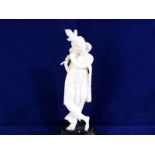 A 19th century carved ivory figure depicting a lady with a flute, on a wooden plinth,