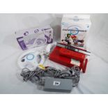Nintendo Wii - a Nintendo Wii games computer (red) a Nintendo Wii steering wheel x 2 and a Playon