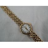 A 9 carat gold Rotary wristwatch with a 9 carat gold strap stamped 375, overall length 19 cm,