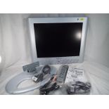 A Hitachi 20 inch flat screen TV with stand, wall bracket, remote control, cables and manual,