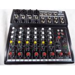A Stageline MMX - 842 six-channel audio mixer,