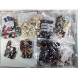 A huge collection of sorted vintage buttons to include wooden,