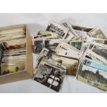 A box containing a good collection of approx 600 mid to early century postcards to include UK and