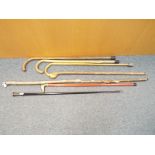 Seven walking sticks / canes, estimate £