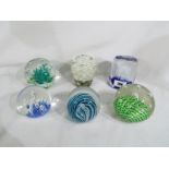 A collection of six art glass dome paper