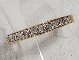 A lady's 9 carat gold half eternity ring