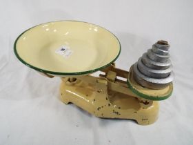 A cast iron weighing balance with enamel