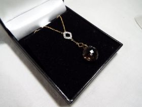 A lady's 9 carat gold with smokey quartz