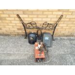 A pair of cast iron garden bench support