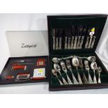 A wooden cased canteen of plated cutlery with contents and a good quality desk set by Zeitgeist,