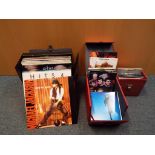 Three record carry cases containing approximately 25 x 33.