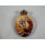A good quality ceramic oval perfume bottle decorated with a depiction of a lady and gentleman clad