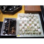 A marble complete chess set, a wooden set of chess pieces, King measuring 7.