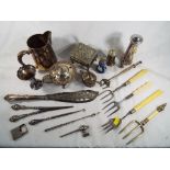 A good mixed lot of silver and plated ware comprising glove stretchers, button hook,