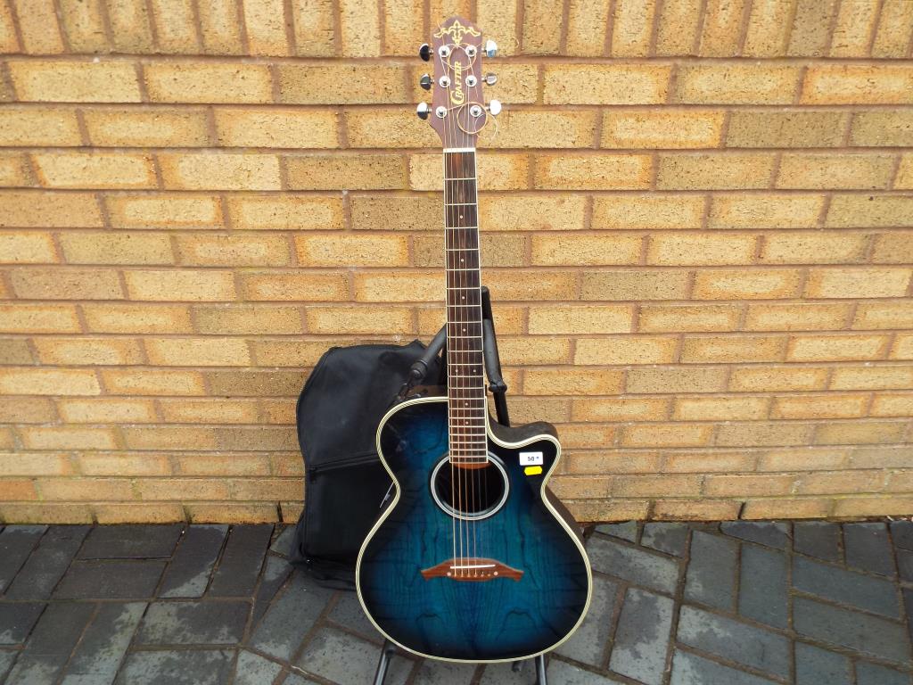 A Crafter semi acoustic 6-string guitar, blue, displaying Crafter paper label model No.