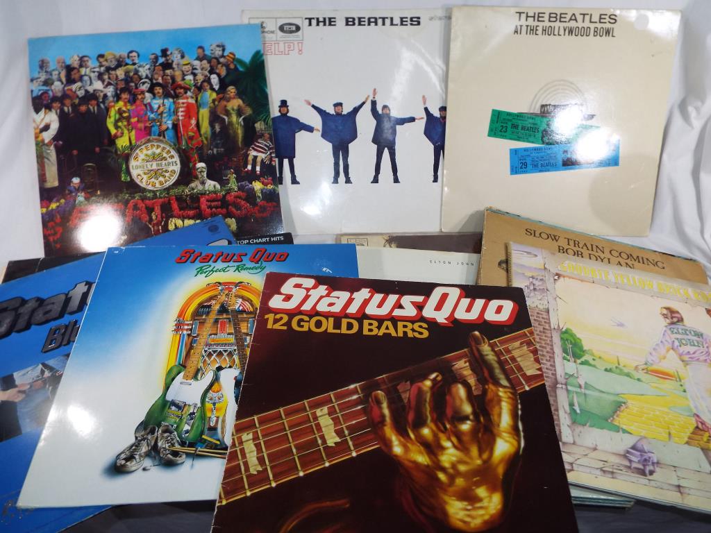 A collection of vinyl record albums to include Beatles Sgt Peppers Lonely Hearts Club Band,