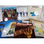 A collection of vinyl record albums to include Beatles Sgt Peppers Lonely Hearts Club Band,