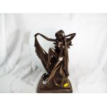 An Art Deco style lamp depicting a lady with glass backdrop approximately 38 cm (h)