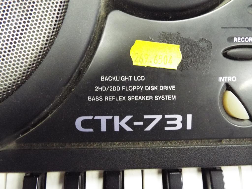 A Casio CTK-731 multi-function electronic keyboard together with a General Motors in-car 6-disc CD - Image 2 of 2