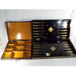An unusual lacquered gaming box decorated with Asian gilding to the edges and a good quality wooden
