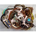 A quantity of costume jewellery to include bangles, bracelets,