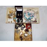 Three boxes containing a quantity of good quality costume jewellery to include vintage brooches,