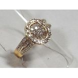 A lady's 9 carat gold ring set with 50 pt 1/2 ct bagette and round diamonds, size M + 1/2,