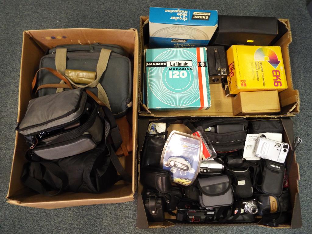 Three boxes of camera equipment to include Canon, Pentax,