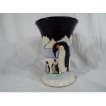 Moorcroft Pottery - a flared vase entitled 'Family on Ice' (penguins) 15.8 cm (h).