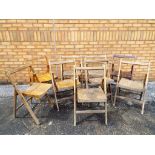 Nine wooden folding garden chairs