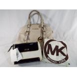 Two good quality lady's handbags marked Michael Kors with label and dust cover,