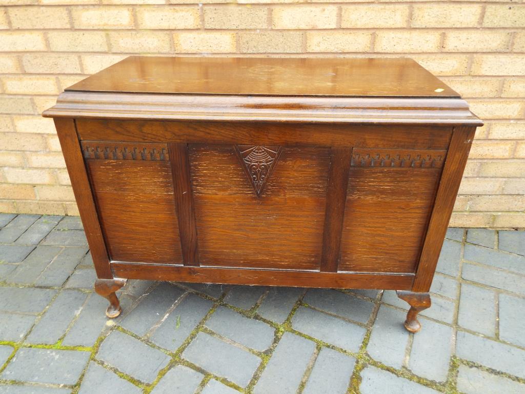 A linen chest with hinge top,